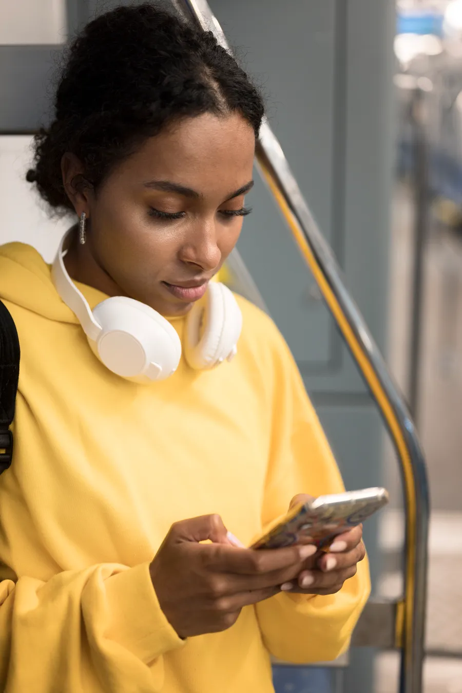 A commuter topping up data on her phone with DADEY